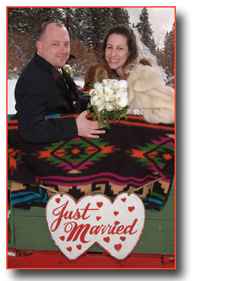 Looking back over the sleigh, the smiling newlyweds were just married