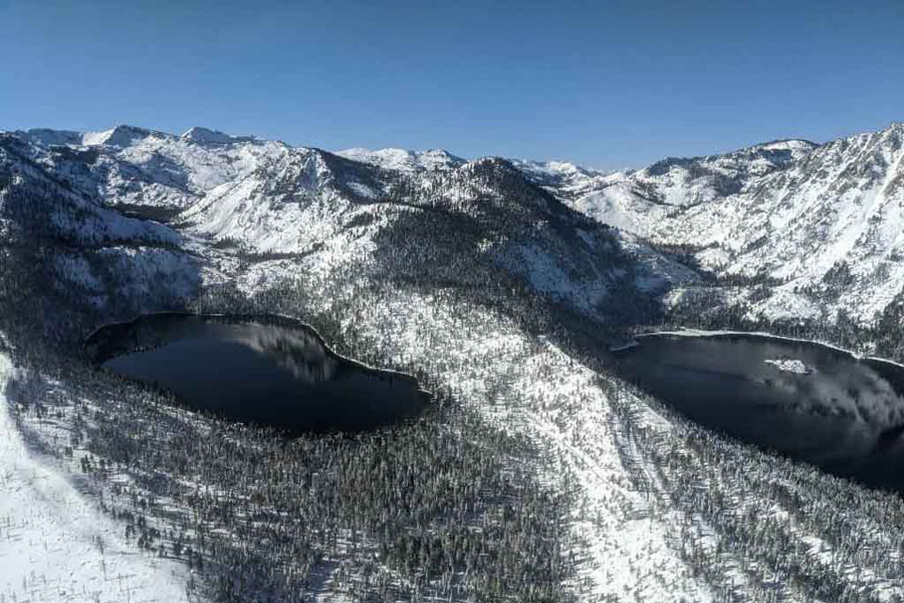 Winter scene of snowcapped mountains as viewed from the helicopter.