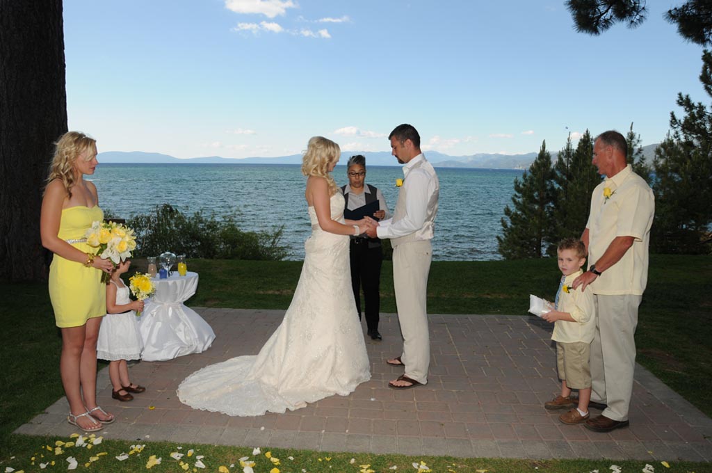 Bridal party have their heads bowed as the minister offers a prayer.