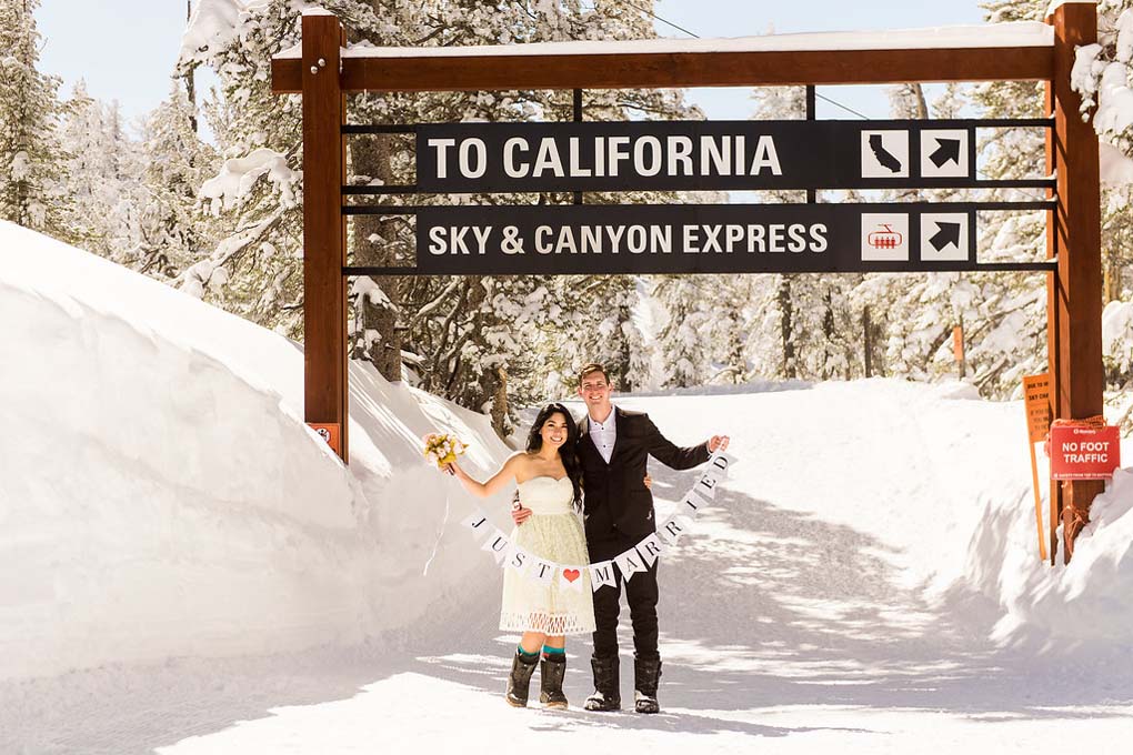 The twosome are holding a sign that says just married.