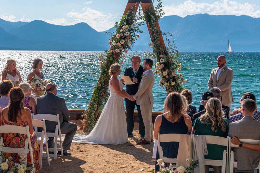Ceremony formalities taking place at The Arch at Lakeside Beach.