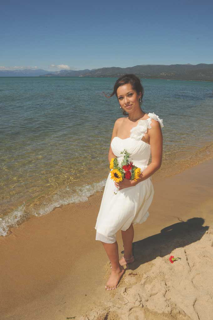 Bride on the beach with a graceful look.