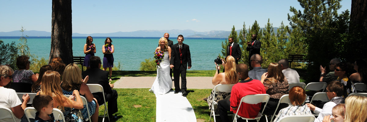 Just married couple walking down the aisle at conclusion of the ceremony.