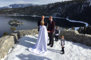Wedding taking place on the snowy bluff of Emerald Bay.