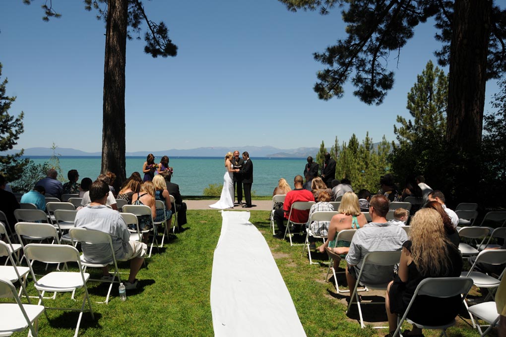 Distant view of the bridal party with a scenic background view of Regan Beach.