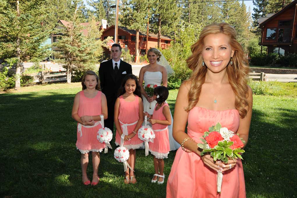 Bridal party gathers on the lawn of Regan Beach as the processional begins.