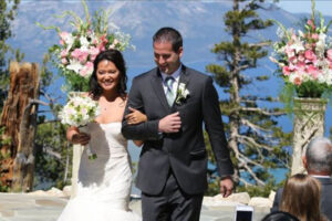 Couple walks down the aisle during the recessional phase of the wedding ceremony.