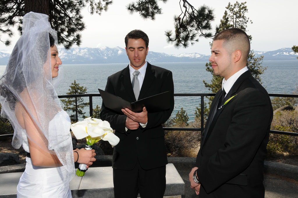 Minister begins the wedding service with the couple facing each other.
