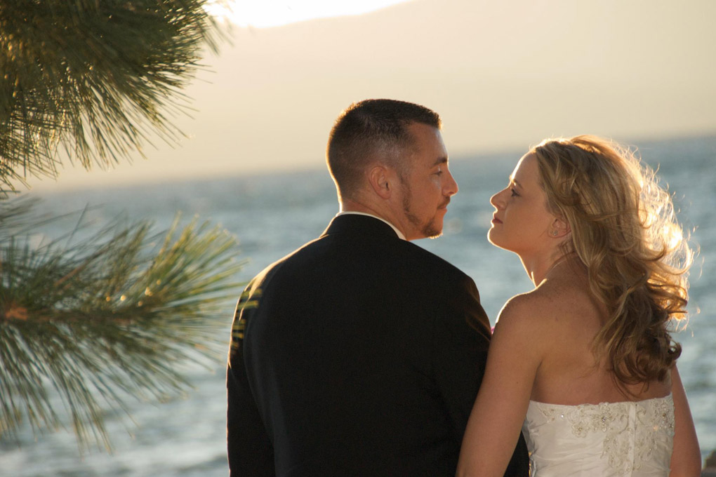 Profile of the newlyweds looking at one another.