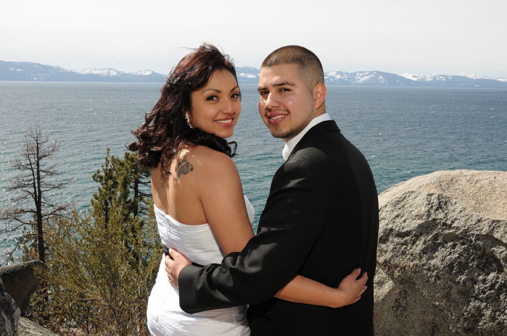 Newlyweds looking back over their shoulders.