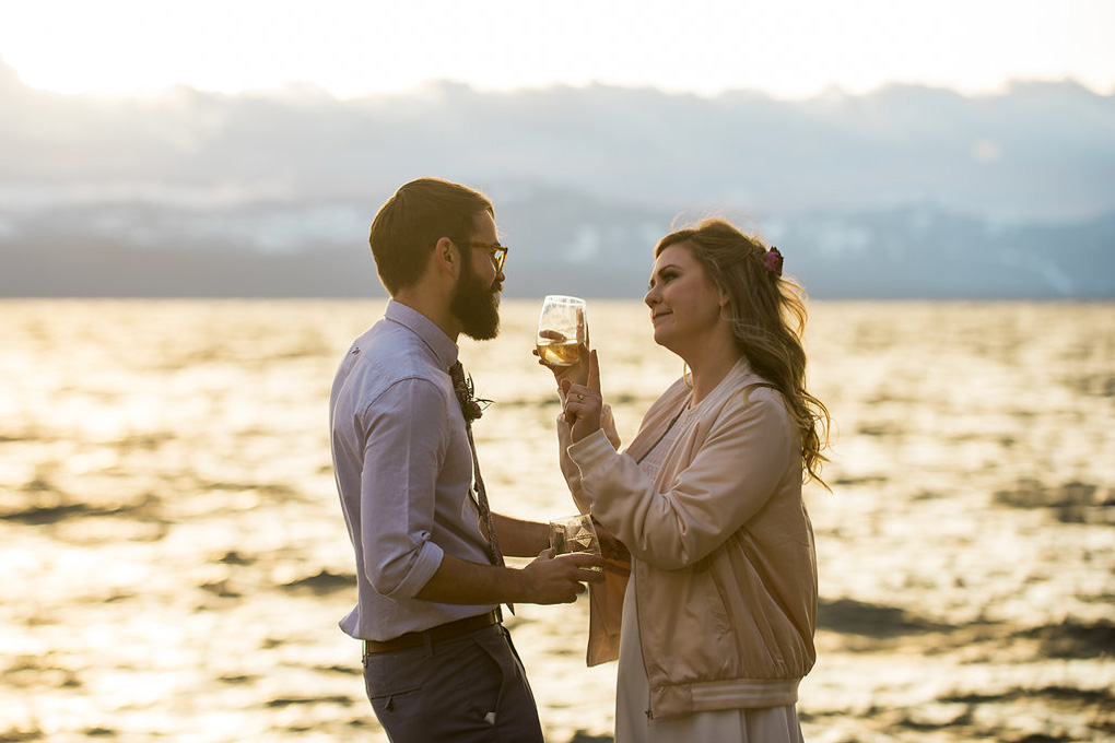 Just married husband and wife gaze at each other admiringly.