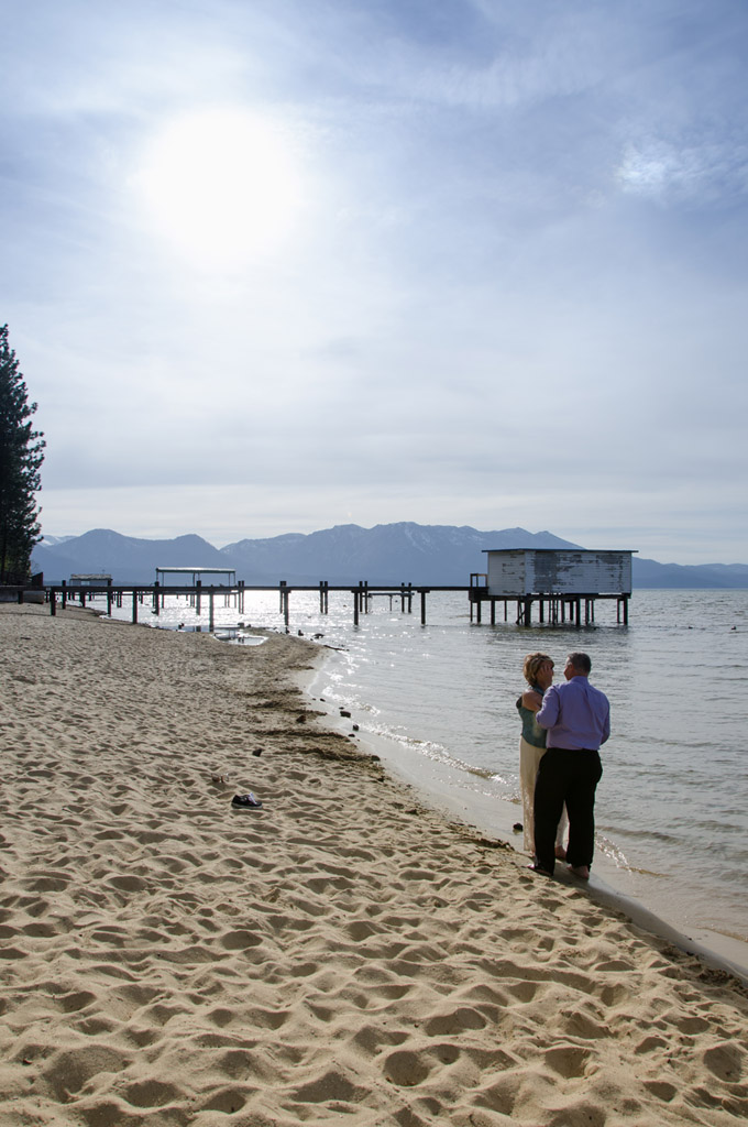The couple take a special moment together on the beach after their wedding ceremony.