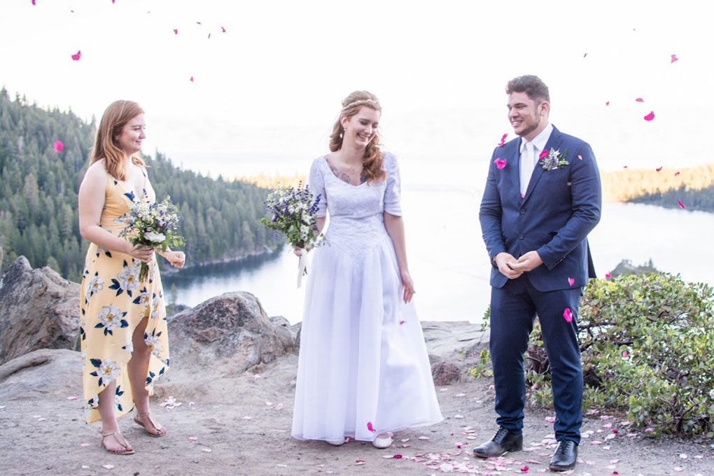 Confetti flies in the air as the married pair celebrate at Emerald Bay.