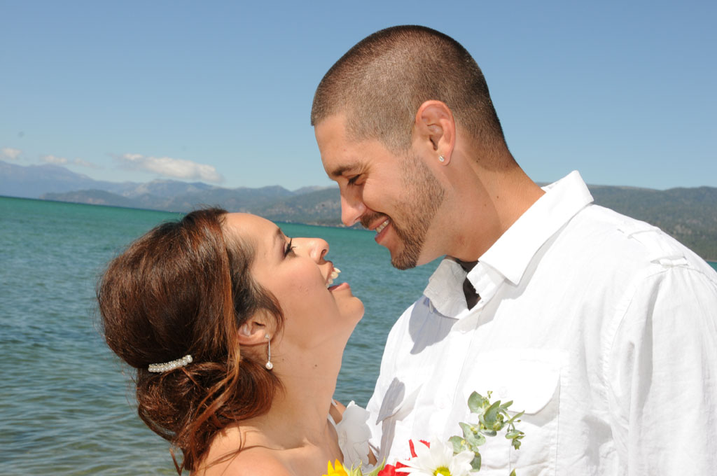 The just married pair looking face to face at each other.