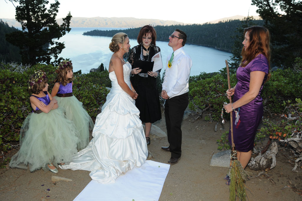 Family gathered near the bluff of Emerald Bay as they hold a Jumping the Broom celebration.