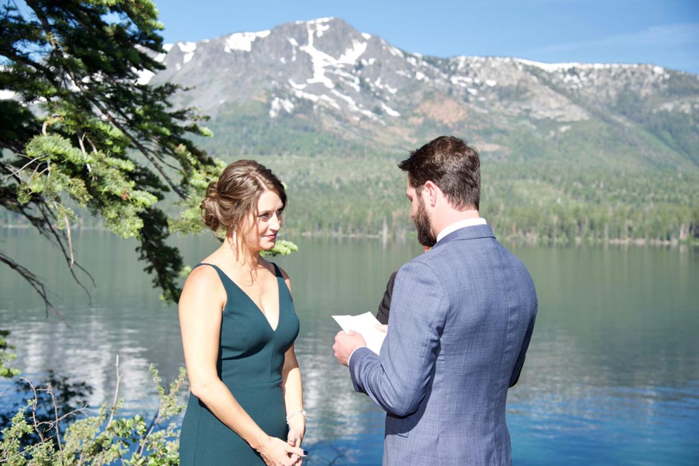 Young couple exchanging their vows near the shoreline of Fallen Leaf Lake.